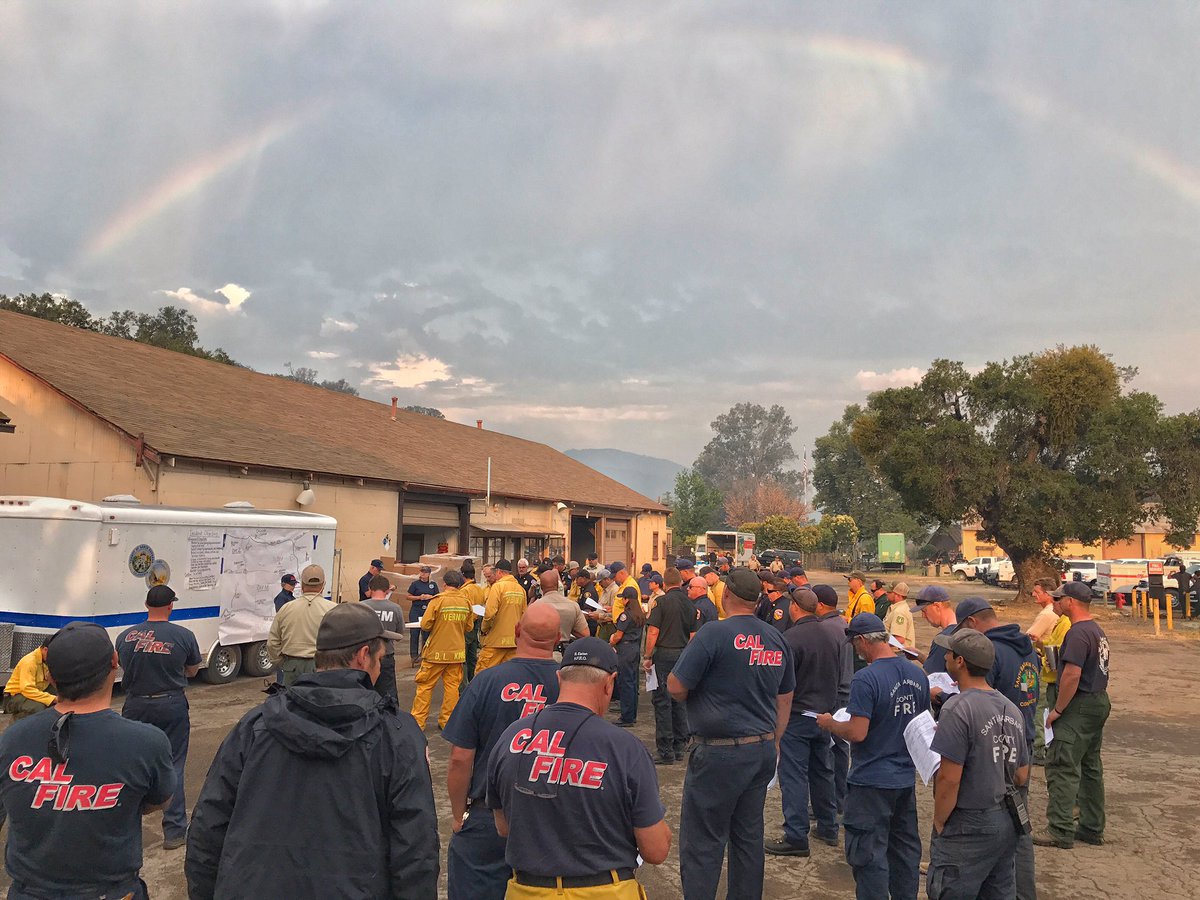 VegetationFire- #WhittierFire- A rainbow forms above the fire Sunday morning as the 7 am briefing is underway. 7,800 acres, 5% contained.