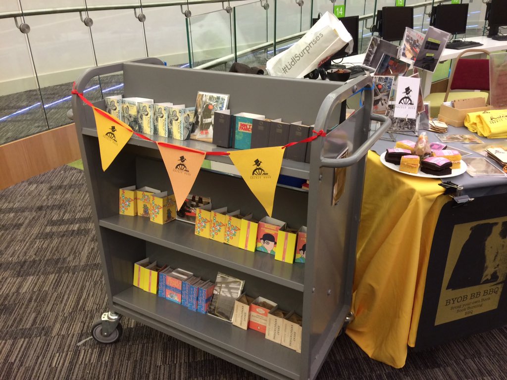 ChloeSpicerArt's tweet image. What's this? A trolley full of book cakes, baked by @FuriouslyFree and bound by meeeee @LpoolBookArt