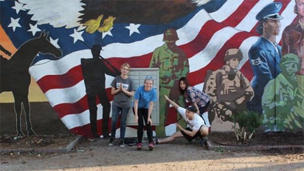 universityofga's tweet photo. Five #UGA art students created a public mural in Rutledge, GA to honor veterans @ldsoa https://t.co/hVnLpkXyn0