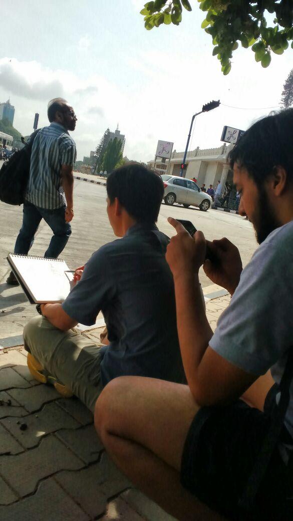 SjcBVoc's tweet photo. #Pedestrian clicking a photo of Fr. Trung Pham #ArtWork at #VindhanSoudha 
@sjcbengaluru 
#BVoc https://t.co/d7cKOTbjmg