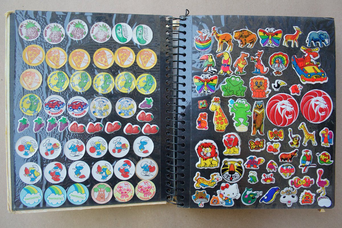 WooWork's tweet image. My sticker book from the early 80's; gently scratched, heavily sniffed.