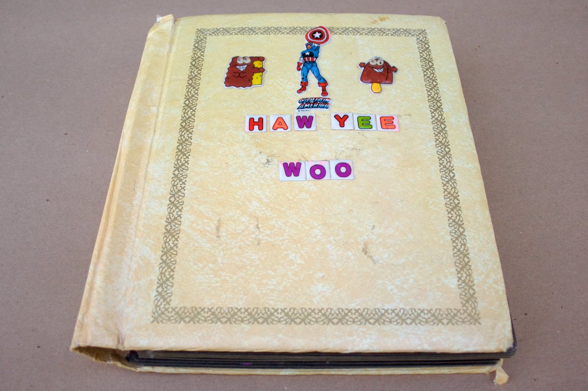 WooWork's tweet image. My sticker book from the early 80's; gently scratched, heavily sniffed.