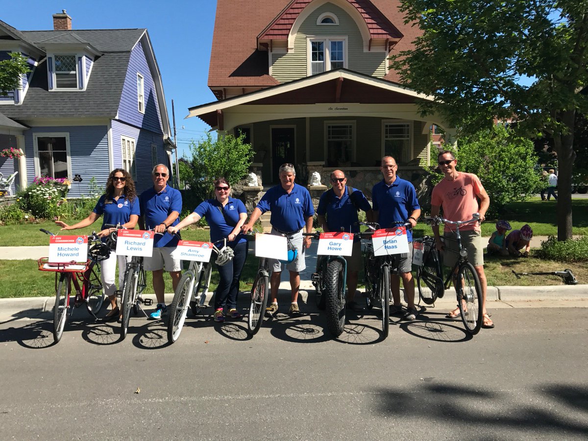 CityofTC's tweet photo. Traverse City Commissioners riding their bikes in the Cherry Royale Parade! #CherryFestival2017 #TCMI #Parade #Bike #BikeTC https://t.co/bVG2iz3IMT