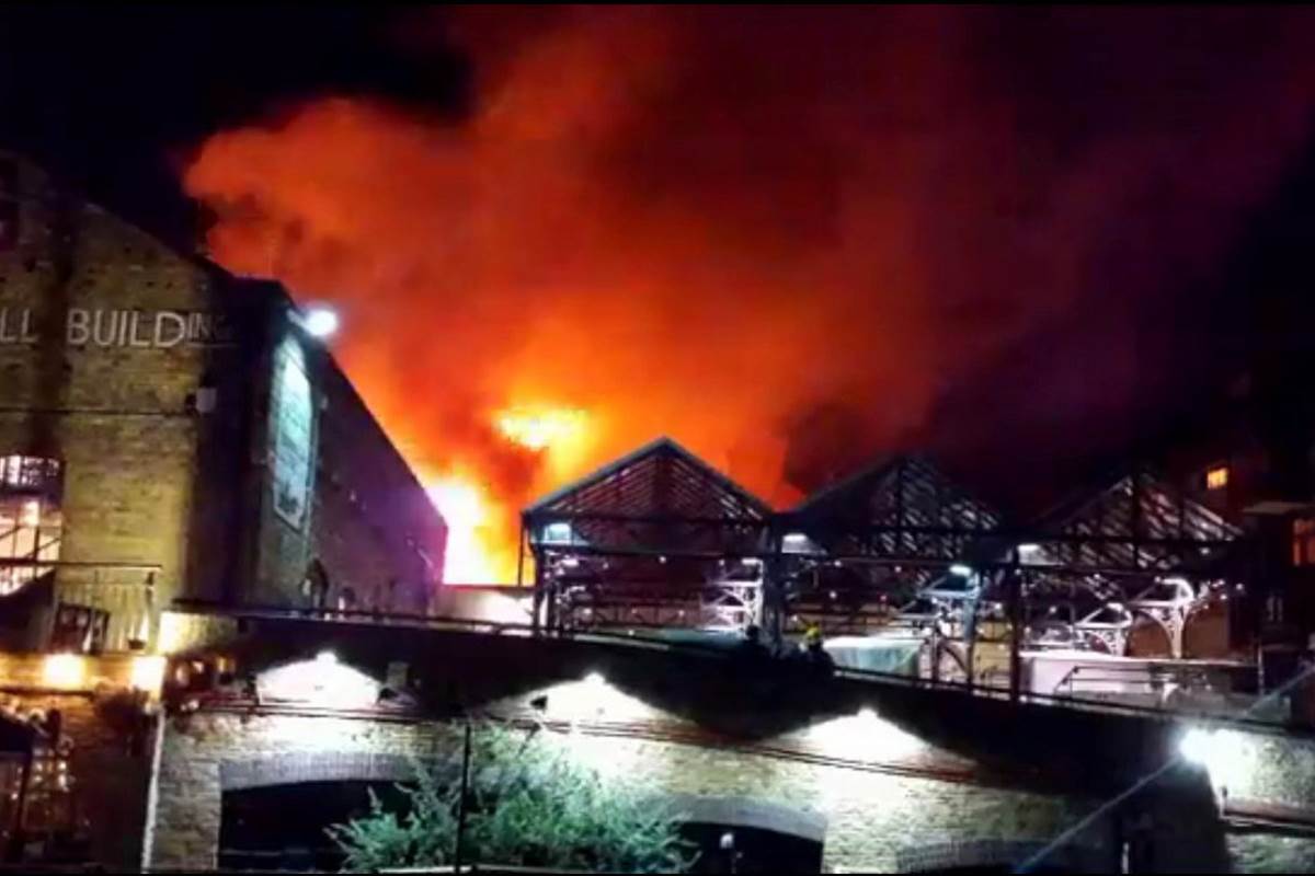 NBCNews's tweet photo. Huge fire destroys part of London’s famous Camden Market https://t.co/Efp7YnaD6R https://t.co/WJIT7LyYep