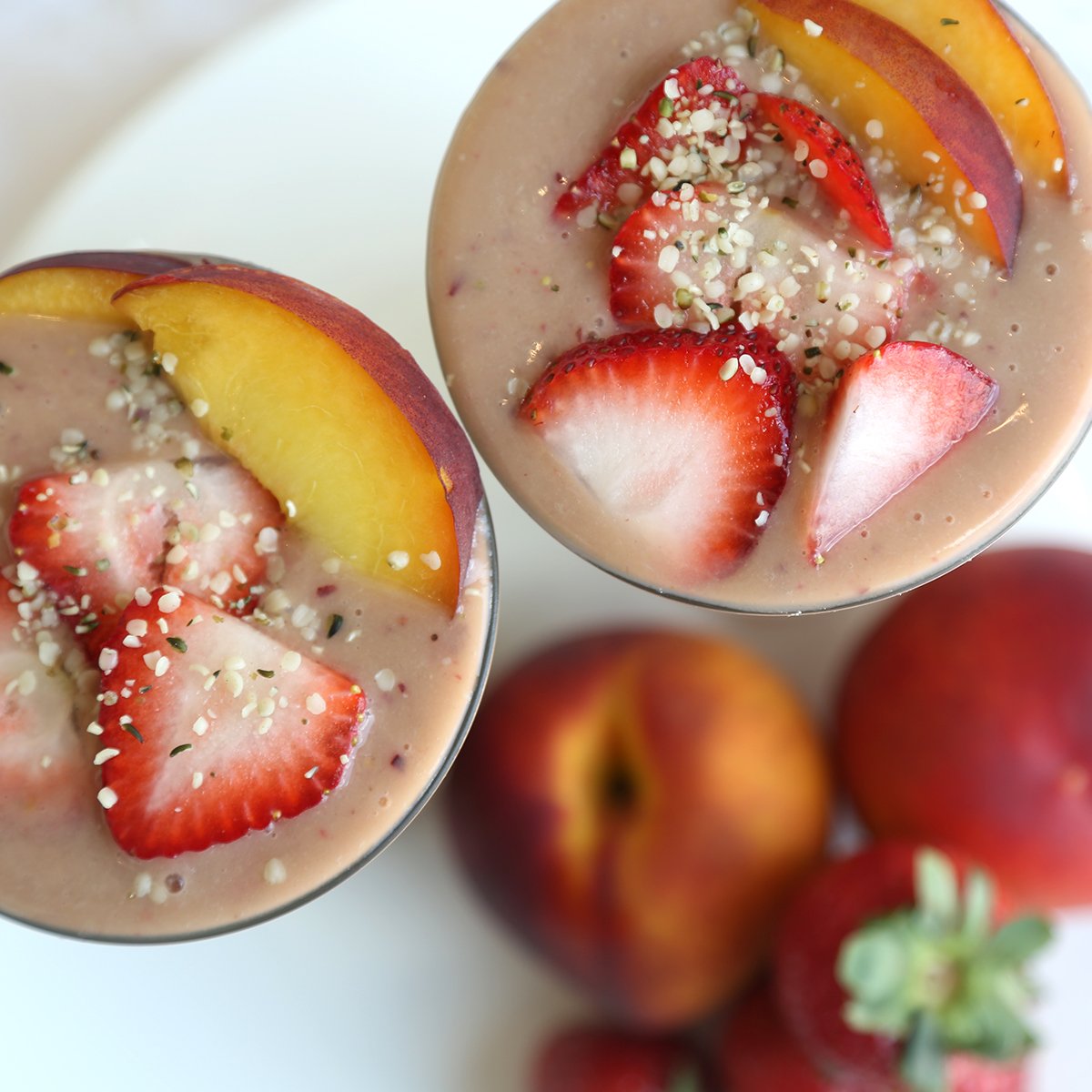manitobaharvest's tweet photo. Day 1 of our #SummerSmoothieWeek is our Summer Fruit Explosion packed with #HempPro70. 🍓🍑🍌💪 https://t.co/zkpkixXzPY https://t.co/i8oWCRwPPB