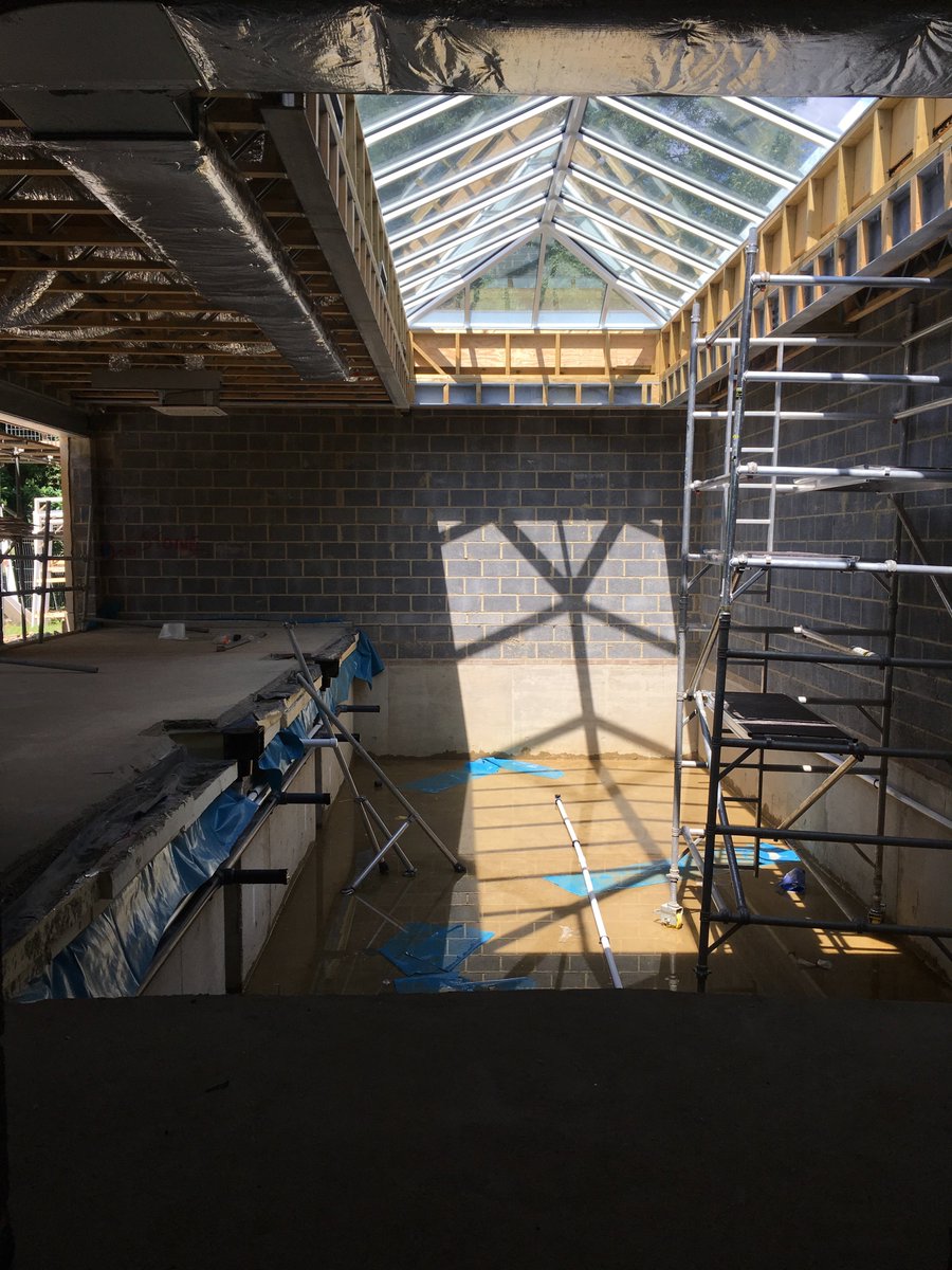 SearchfieldHome's tweet photo. A #luxury heated pool and gym is now under construction at our private commission in #Oxshott, with bifold doors opening onto the terrace https://t.co/BpohS8yCfB