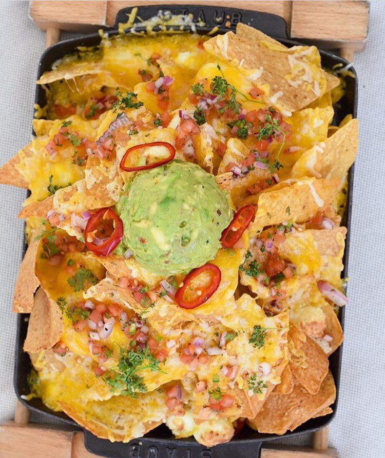 Hungry? We got the original "Not Ya Mama's Nachos" at the pool deck daily from 11- Sundown! Come check us out. (📷 IG: succulentbite)