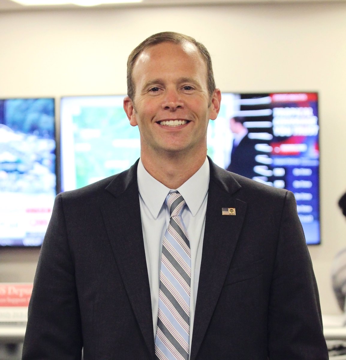 The FEMA administrator smiles at the camera.