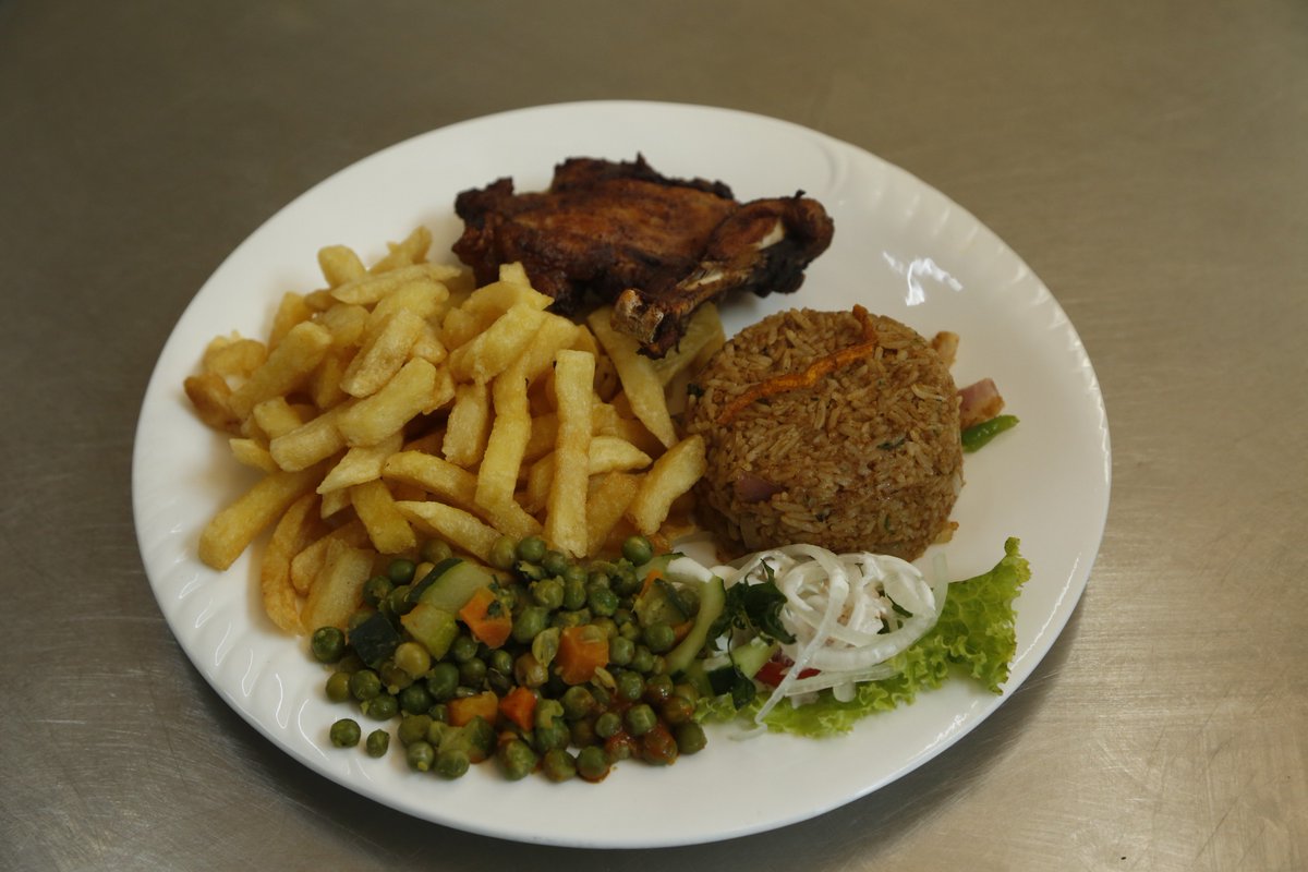 CamelliaKgl's tweet photo. A marinated chicken leg /breast gently pan fried & served with seasonal vegetables & a choice of rice/ chips.Ask for a #QuarterChicken #RwOT https://t.co/BZf5sWxbIg