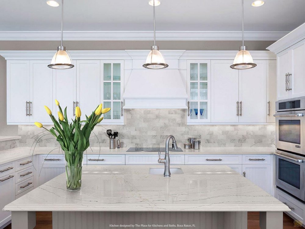 Small accents like a sink-side bouquet and eye-pleasing glass soap bottles elevate the mood of your kitchen.
Featured Design: Ella™