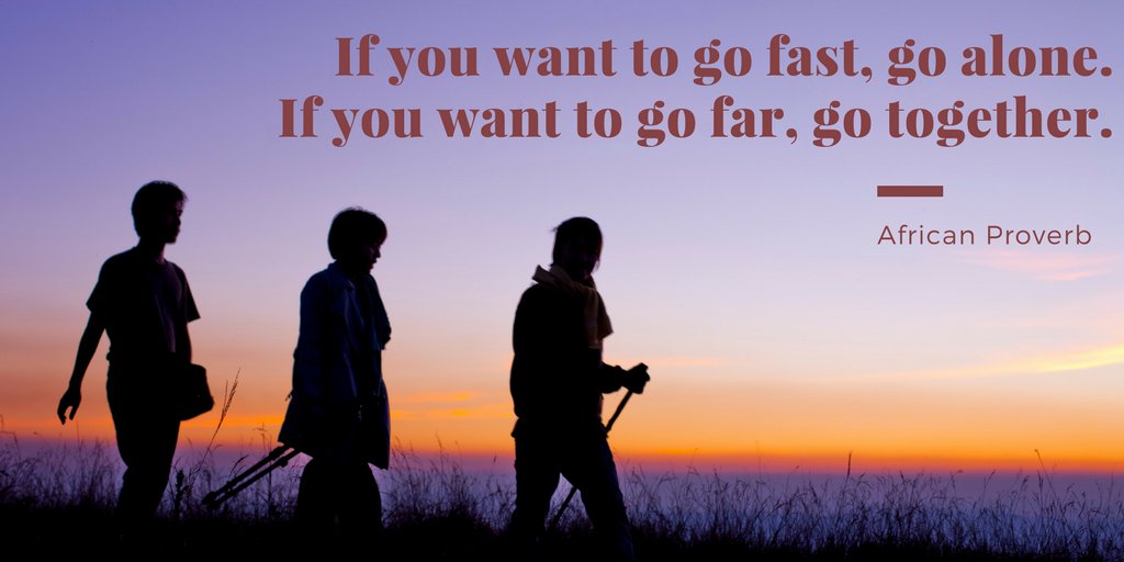 African Proverb, "If you want to go fast, go alone.  If you want to go far, go together."  Silhouette of 3 people hiking together in a field during sunset with the proverb written in the sky. 