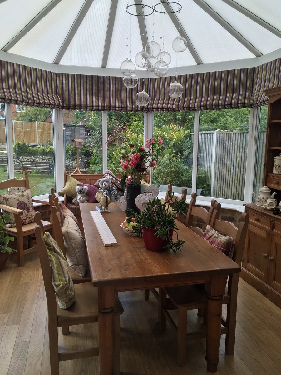 Recently installed conservatory Roman blinds made in Damson Versia from the Iliv collection.