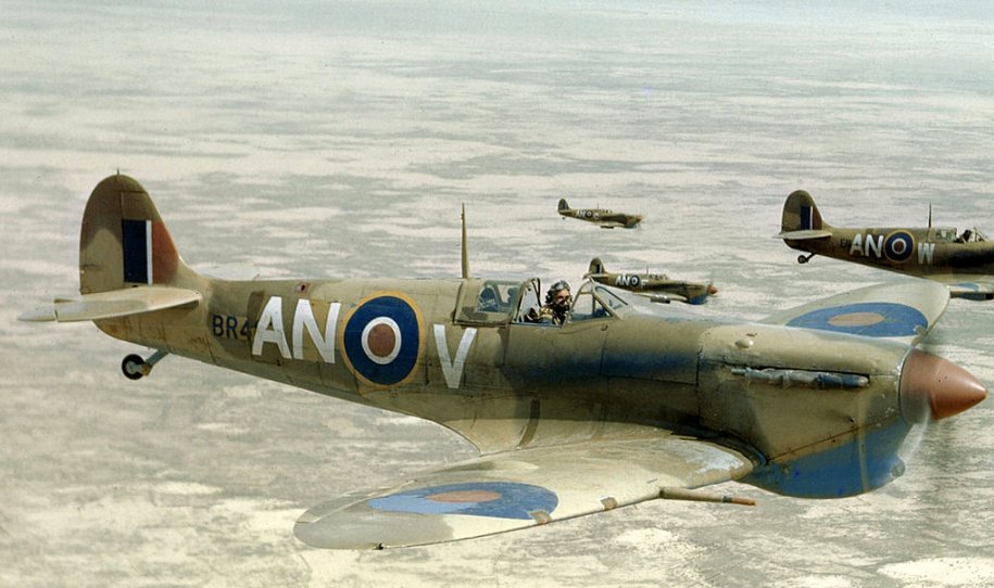 Canadian Spitfire V's of 417 Sqn. in loose formation over the Tunisian Desert in April 1943.