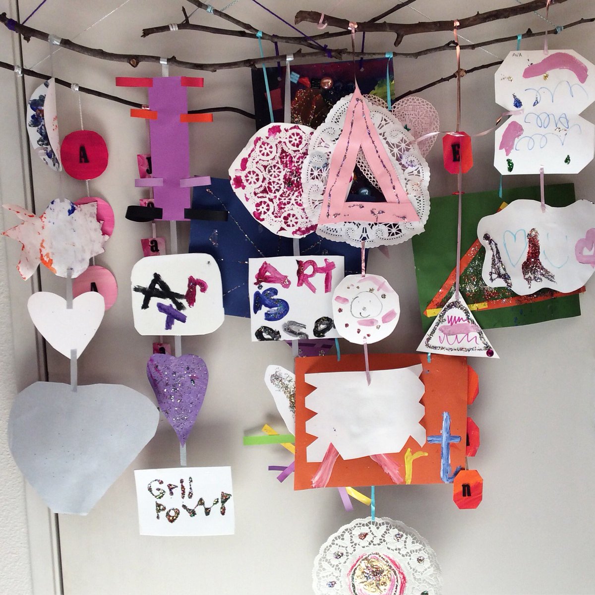 Last week's 5 &amp; 6 year olds children's Young at Art class, containing all girls, made girl power paper mobiles. There are two weeks left.