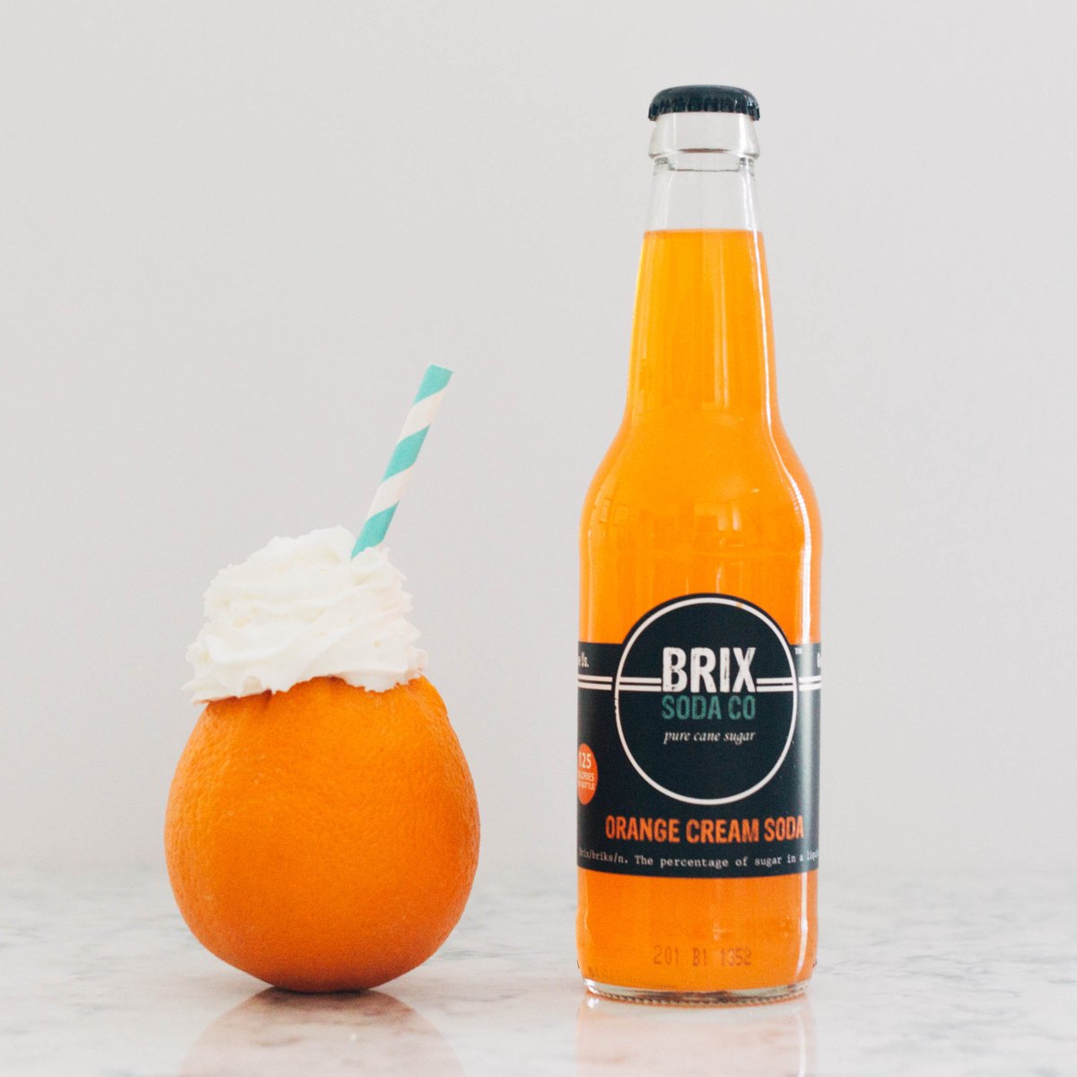BrixSodaCo's tweet photo. Orange Cream Soda is like summer in a bottle! Cold out of the bottle, or poured over vanilla ice cream, it's perfect for this weekend. https://t.co/GCjf3dV3ZN