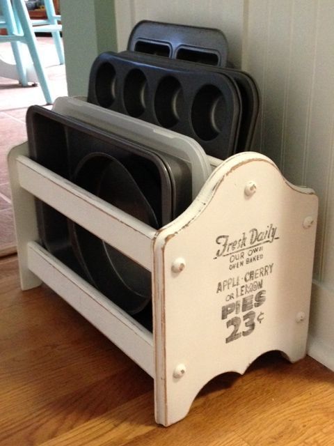 Make over an old wooden magazine holder and use to hold baking pans, cooling racks, cutting boards, etc.