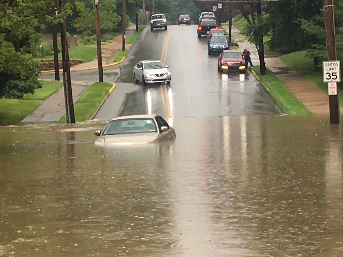 celestevank's tweet photo. East Beau Street at The intersection of North Avenue flooded. A car submerged under water. https://t.co/asrmToQioV