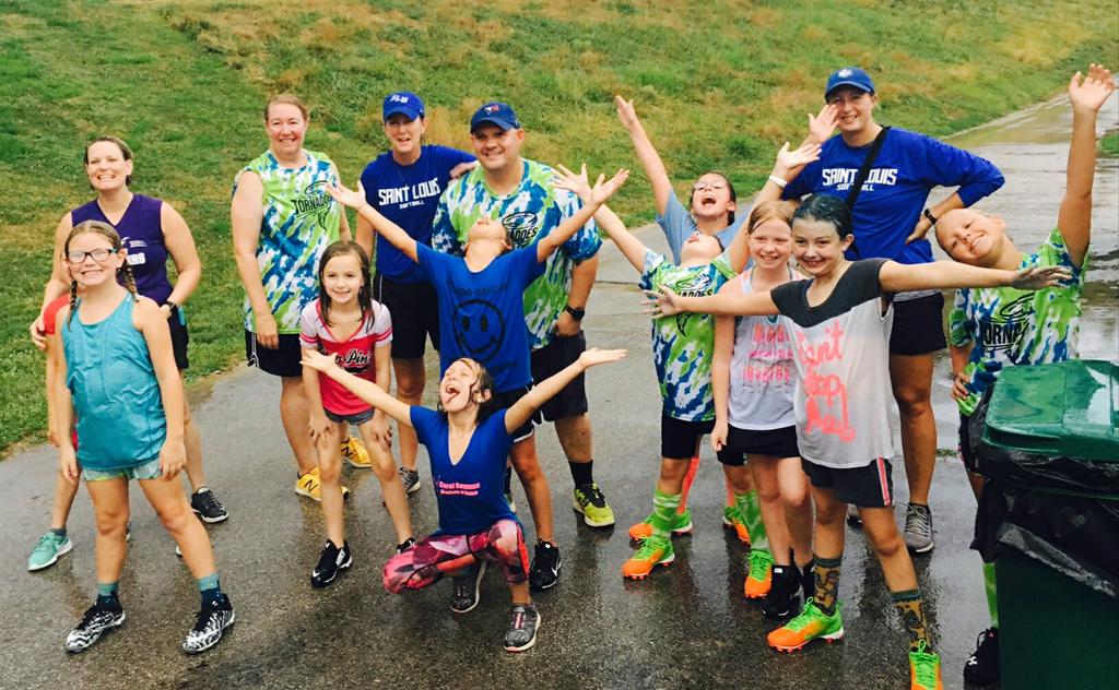 SLUSoftball's tweet photo. A little rain didn't stop us from teaching some softball!  #SoakedButSmiling https://t.co/TB5yvGMDw0