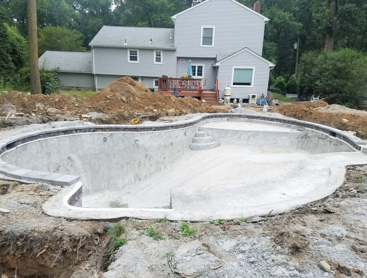 woodsidepools's tweet photo. #GunitePool almost complete in #Wayne 🔟 #WoodsidePoolDesign #NJPool #OutdoorLiving #SummerProject https://t.co/bFqQTlGzLU
