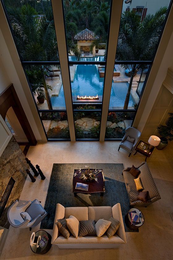 GroupLuxe's tweet photo. A rustic living area with high ceilings and a view of the #pool and firepit, we think this is what #vacation dreams are made of! #luxury https://t.co/kGQyHI4055