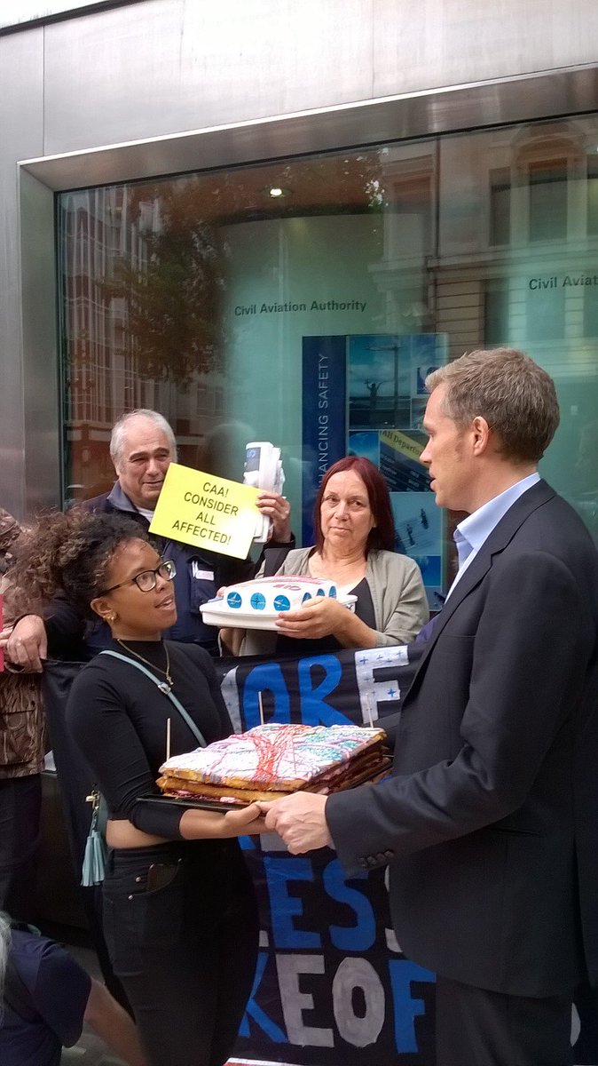 HACANEast's tweet image. CAA joinedin  the spirit of the day when HACAN East gave them a cake to highlight its opposition to London City's concentrated flight paths