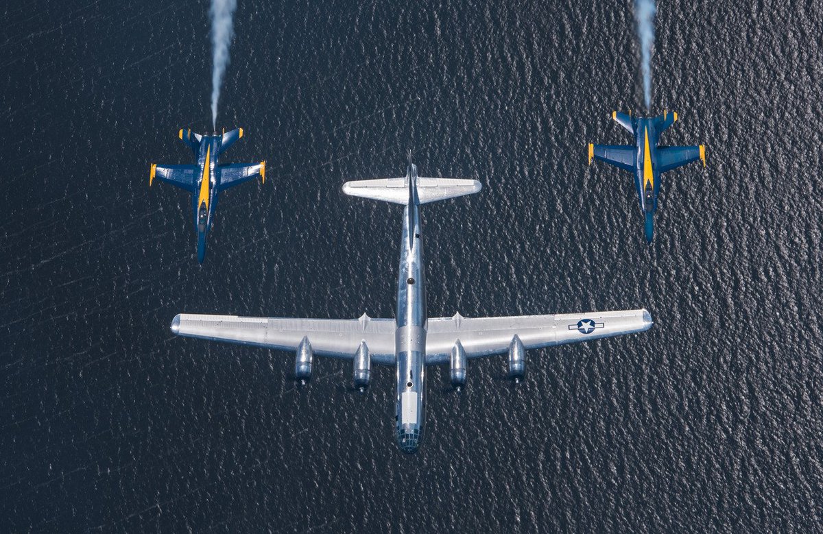 A salute to the past: the <a href="/BlueAngels/">Blue Angels</a> pay homage to recently restored B-29 Doc in its first appearance @ Oshkosh! #OSH17 Photo: Scott Slocum
