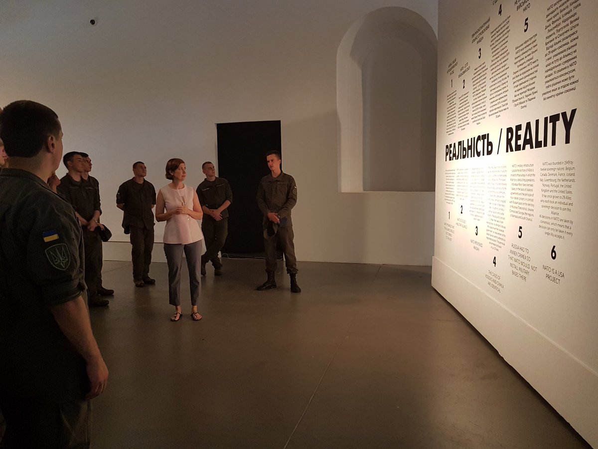 NATOinUkraine's tweet photo. #DirNIDC remembers her first work experience and offers a guided tour over the #Formula4Security exhibition. This time for @NatsGvardiya. https://t.co/2HRz0XnkOw