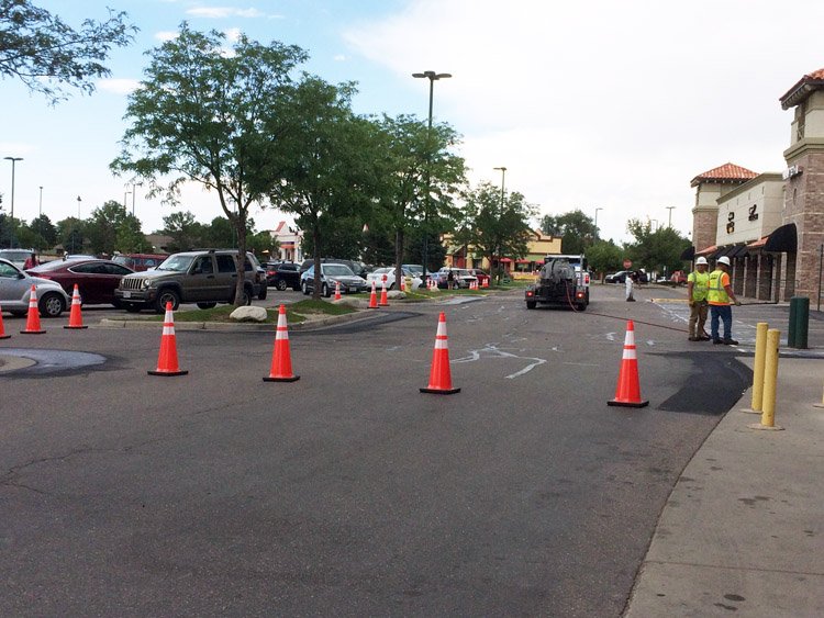 Cones block usual access to Palizzi Marketplace/shops (King Soopers+) @ 4th and Bromley. Parking lot work continues. localcolormag.com/images/DailyPo…
