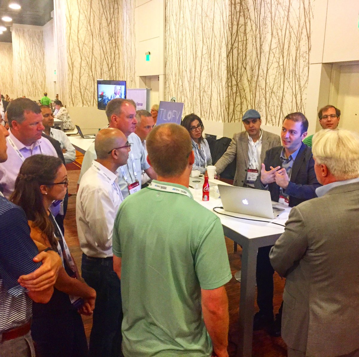 Big crowd gathers for Ali @khoshgozaran CEO of <a href="/Tilofy/">Tilofy</a> booth as he explains his "crystal ball" software at #GBP17 conference #GENBAND
