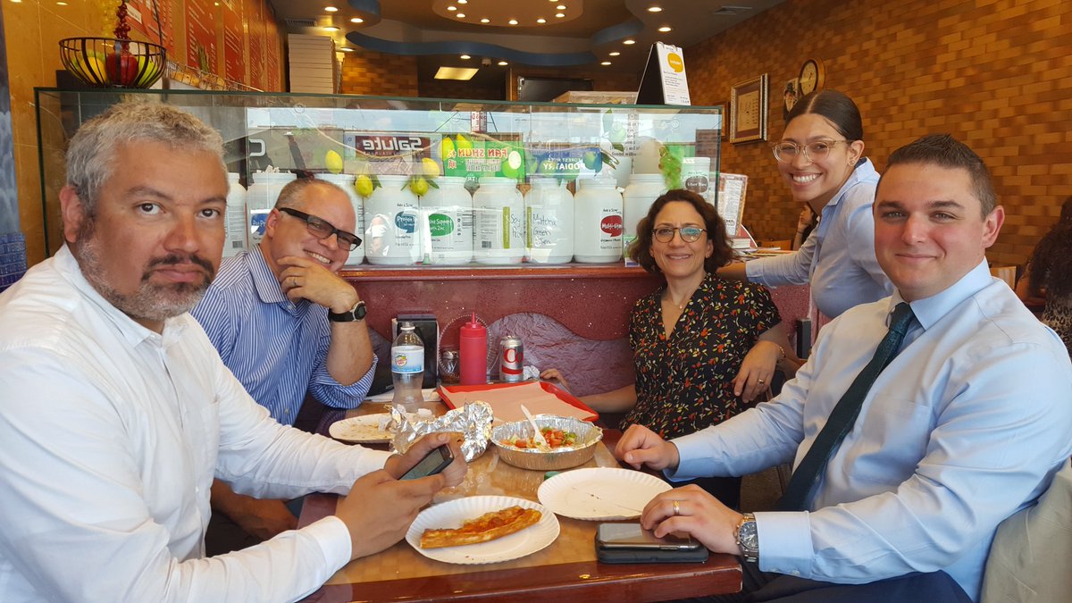 DOT staff sit in a pizza shop for lunch