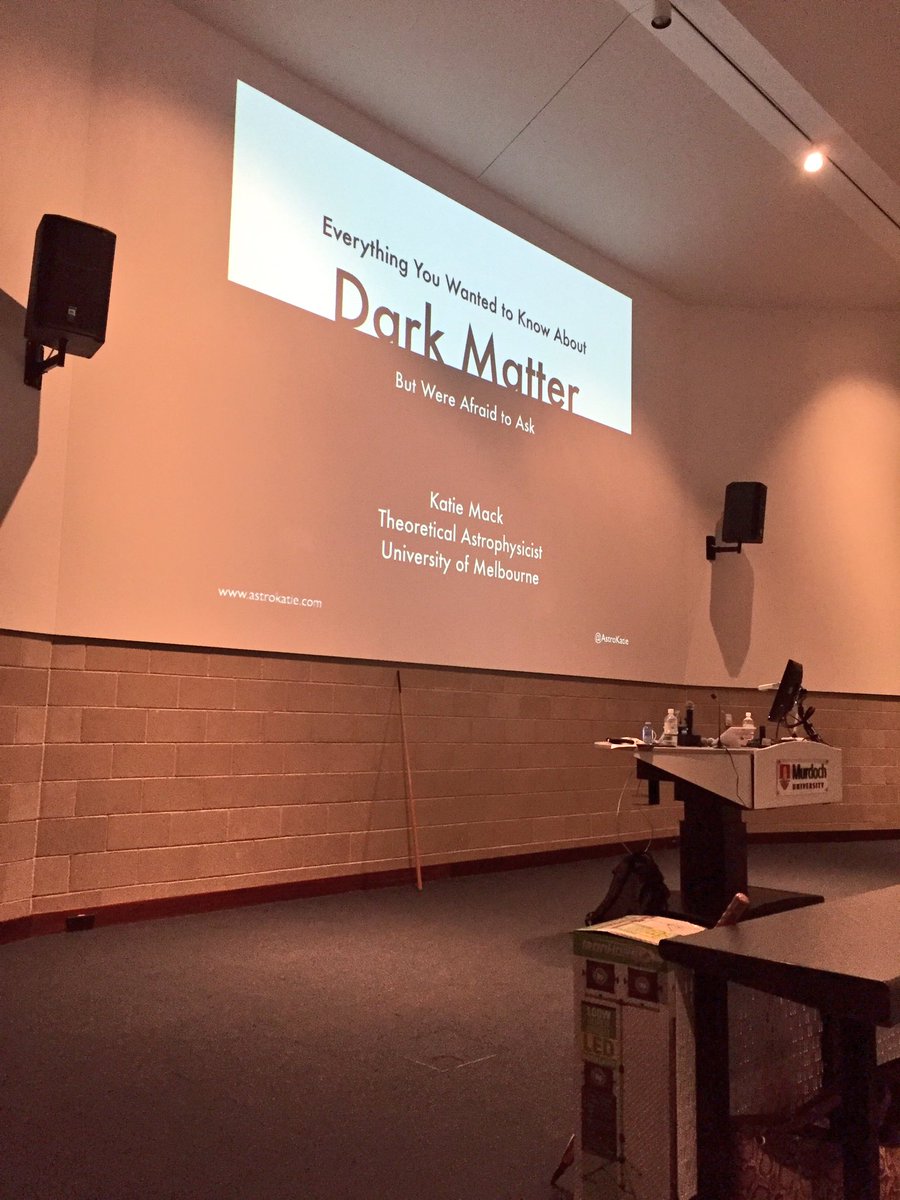 A view of my title slide at the front of an auditorium. Title is "Everything you wanted to know about dark matter but we're afraid to ask"
