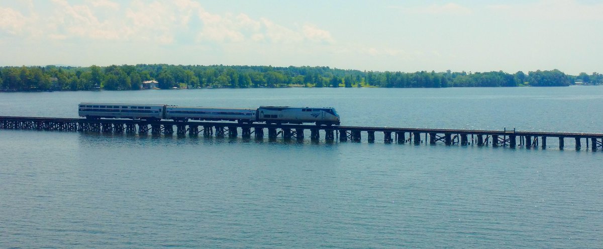 VermontRailfan's tweet photo. @Amtrak special creeps across the Alburgh trestle in Alburgh VT. First Amtrak in 22 years! Welcome back!! #amtrak #vt @TheIslanderNews #amtk https://t.co/LFO5hhq3LP