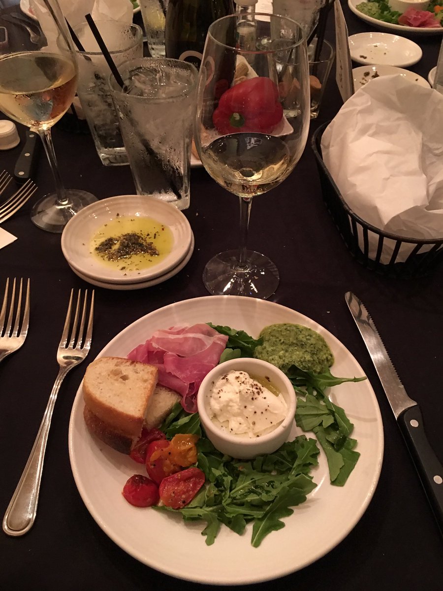 #antipastiplate @Carrabbas surfandturfwinedinner #kimcrawfordsauvignonblanc #proscuittoham #burratacheese #arugulasalad #roatedtomatoes