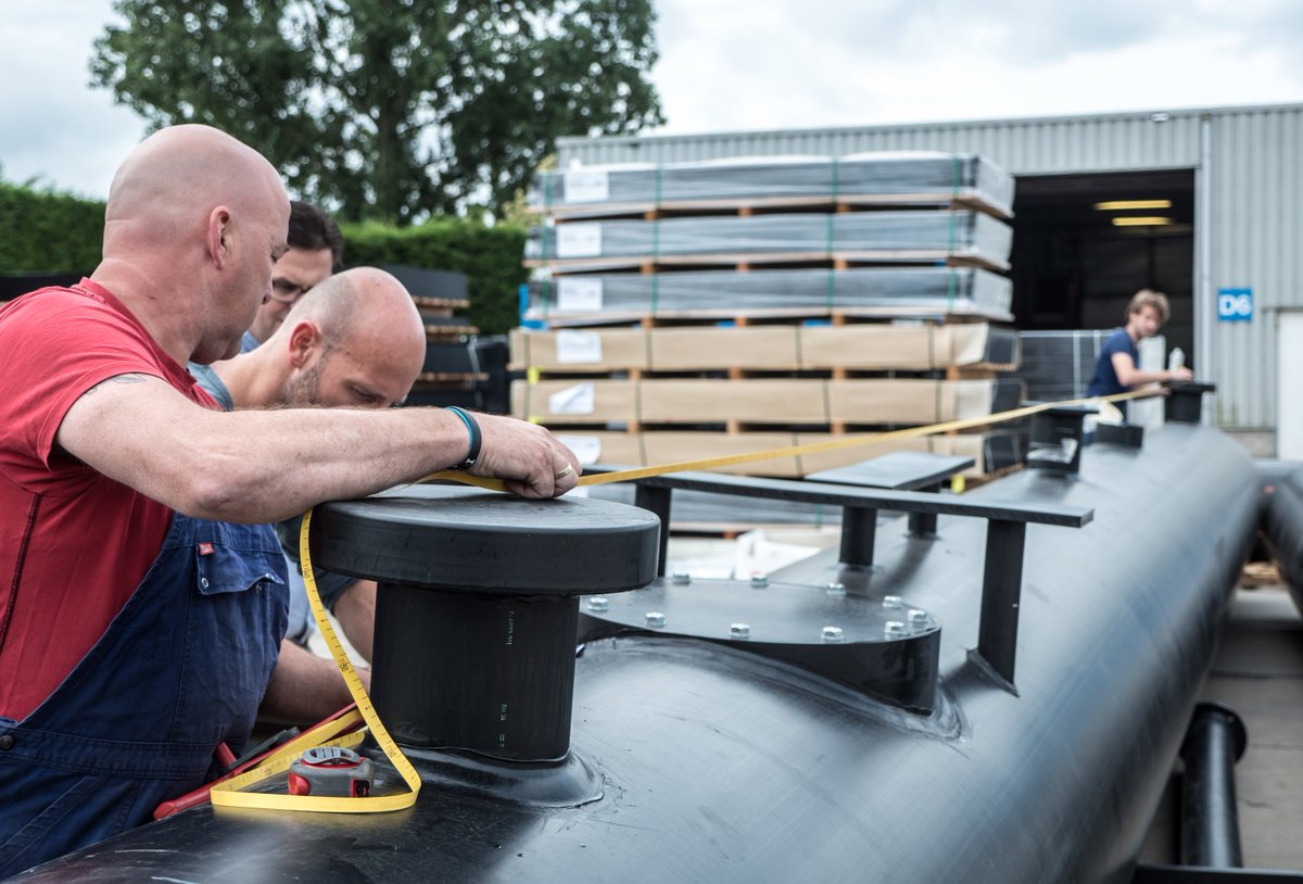 TheOceanCleanup's tweet photo. This 12-meter floater segment just passed inspection. It will hit the North Sea in a few weeks for a new set of tests, full update tomorrow. https://t.co/PLdDU8qaBp
