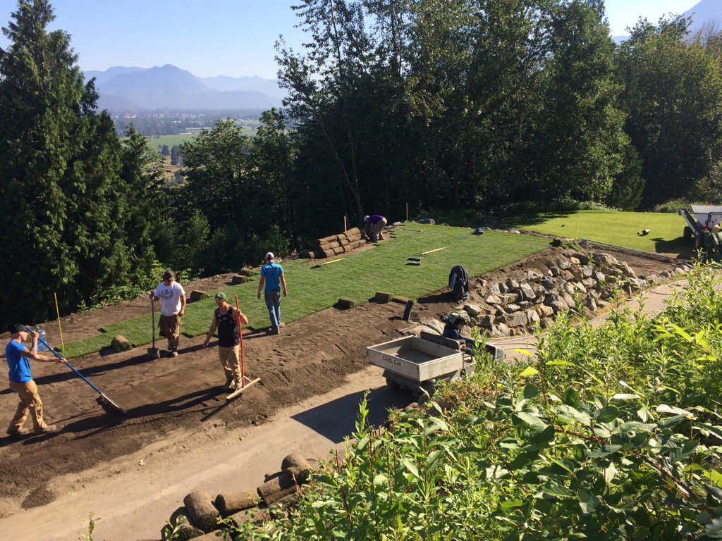 A great crew working hard. New rock wall, irrigation install, soils &amp; sod. 12 tee almost done.