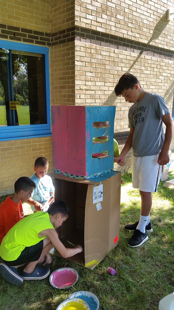 TZiegelhofer's tweet photo. STEM campers don't mind painting in the heat when they're on a mission!!! @RyanBrood4 @ARPanthers #cardboardcarnival #arstemcamp2017 https://t.co/TpMfe6kMcV
