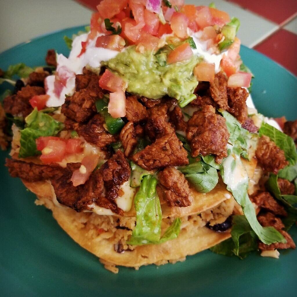Green chili beef stacked tostada! 2 tostadas with whole black beans