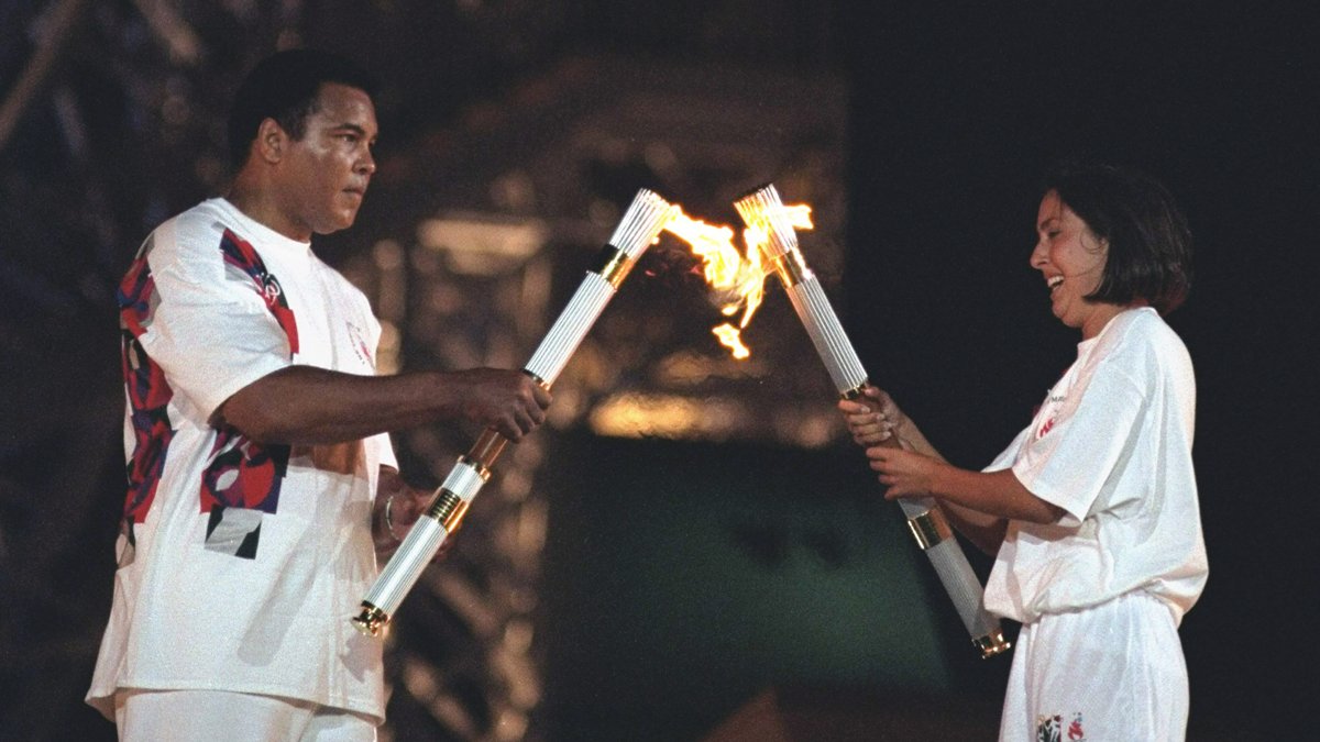 LA28's tweet photo. 2️⃣1️⃣ years ago today #LA2024 Vice Chair @janetevans passed the Olympic 🔥 to Muhammad Ali in Atlanta, opening the Centennial Olympic Games! https://t.co/k85A8E56tm
