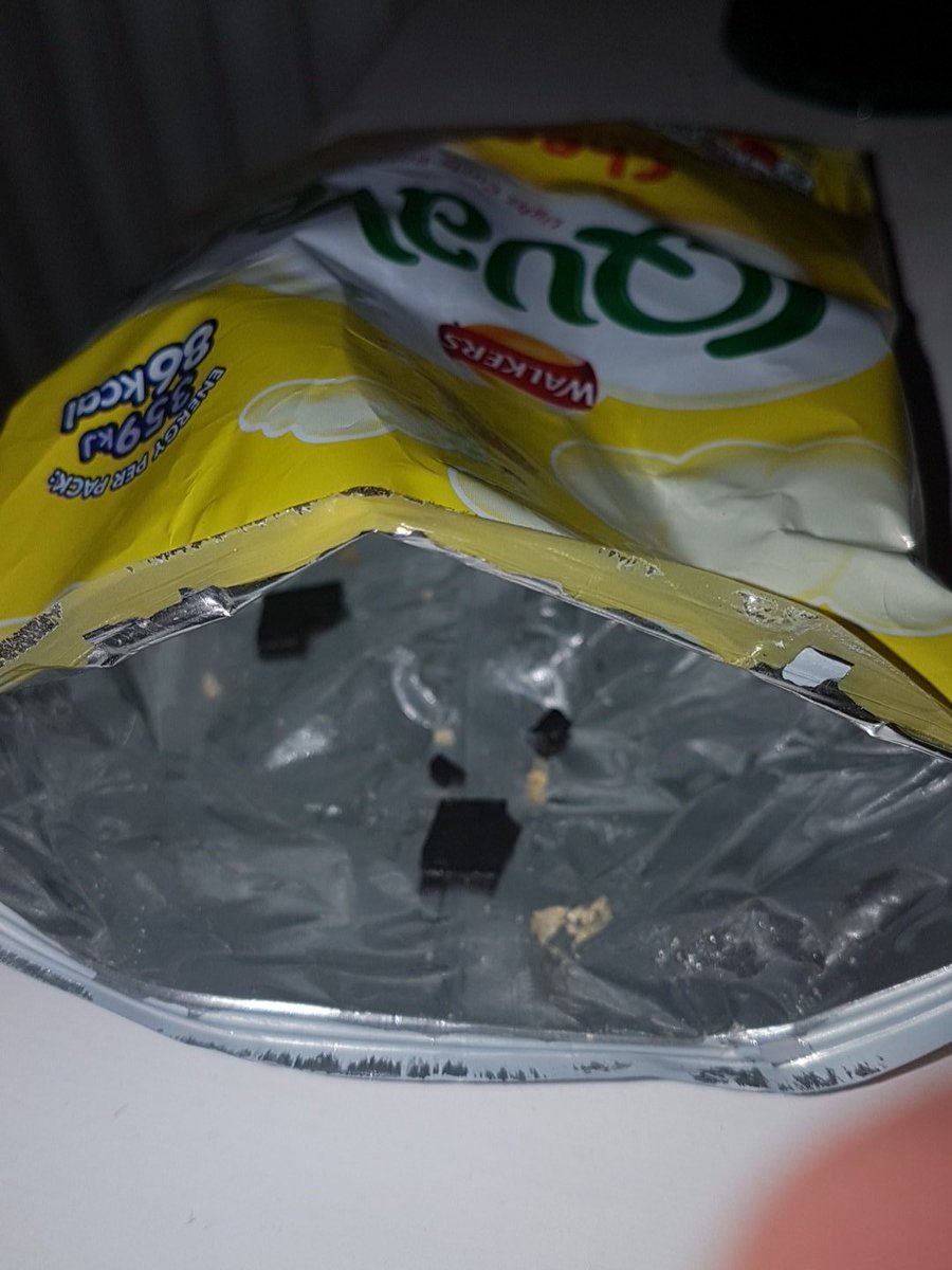 sean_reddington's tweet photo. @walkers_crisps found some sort of black plastic in the bottom of the bag 😯 not cool.... https://t.co/LwNjSTq7J3