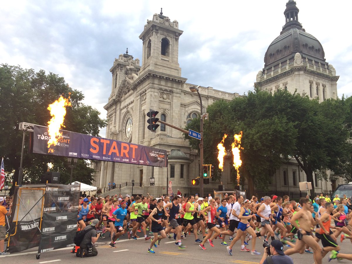 Aquatennial's tweet photo. And we're Running With Fire🔥 
The @Torchlight5k is officially underway! 
#Aquatennial @lifetimefitness @twincitiesortho #RunWithFire https://t.co/uQG3f42JnM