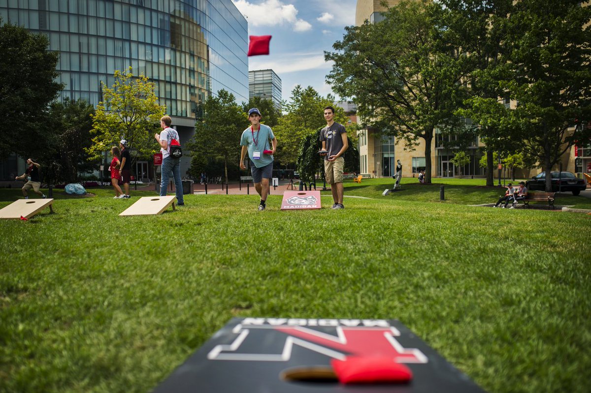 Students play cornhole as part of Husky101 @NUOrientation. #NUexperience