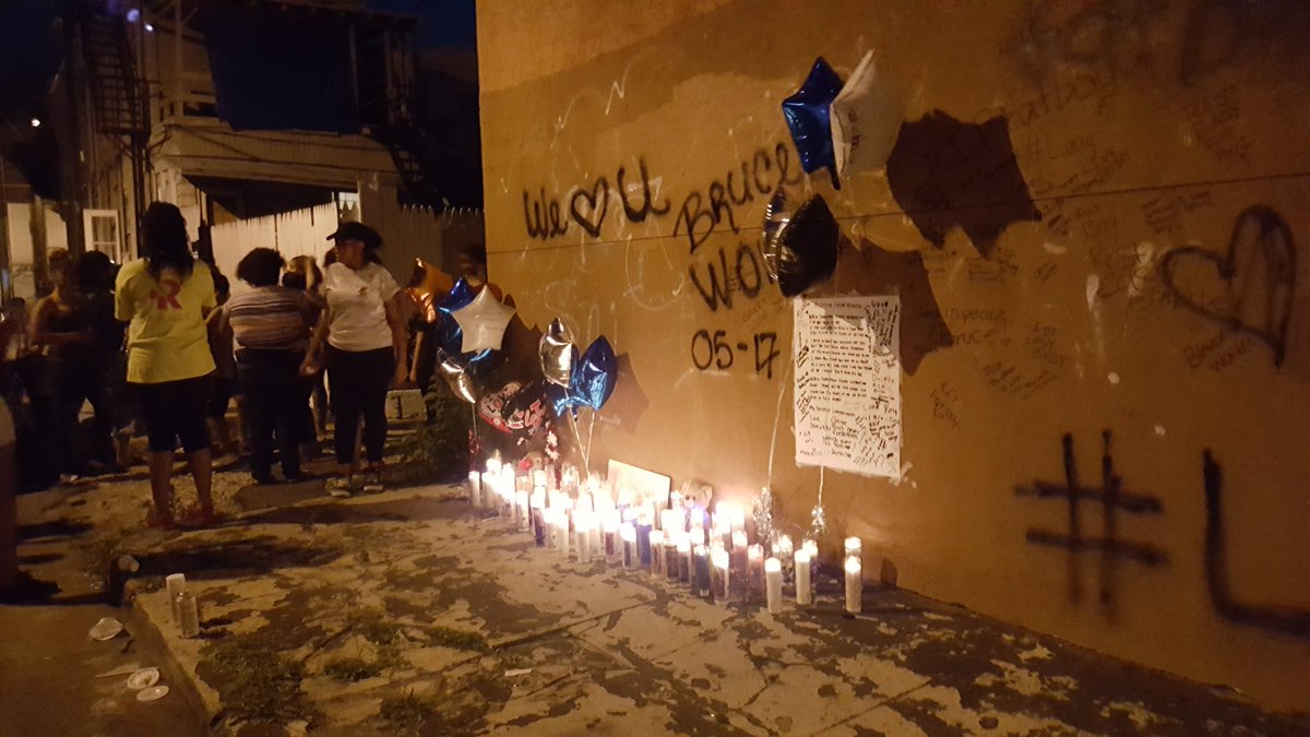YoderReports's tweet photo. Friends & family gather at a memorial on Mulberry St for Bruce Criddell killed Tuesday. The alleged shooter is in custody. #BruceWorld https://t.co/XUWEJykdPQ