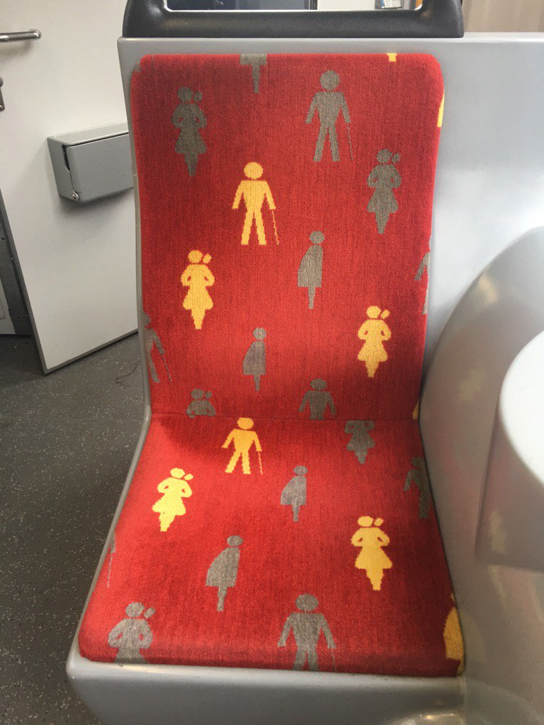 JymnMagon's tweet photo. A seat on an Amsterdam tram... obviously reserved for people w canes, fat folks &amp; women w two heads. https://t.co/i4B0wmcQI1