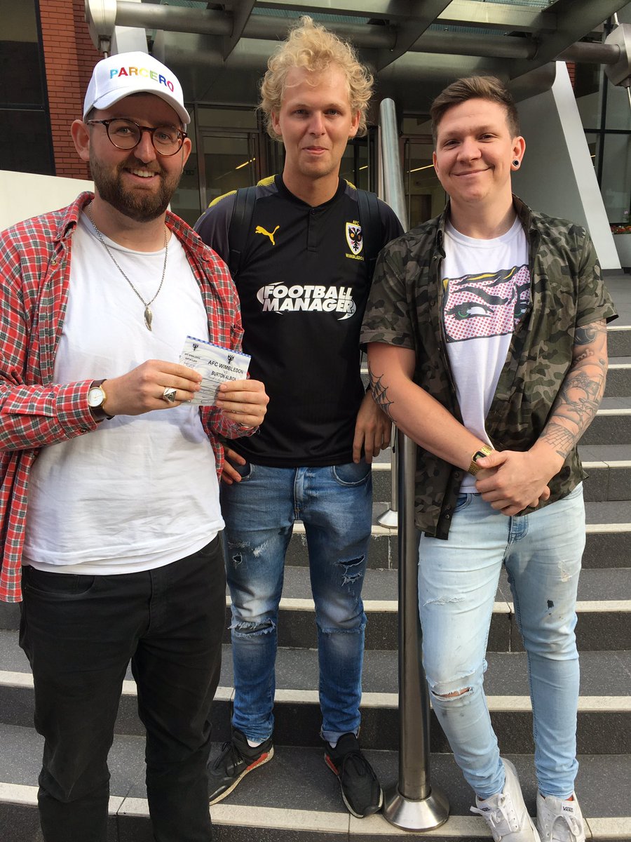 AFCWimbledon's tweet photo. These lucky Dons fans each won 2 match tickets for tomorrow's pre-season friendly against The Brewers! Congratulations! #goodscouting 😉🕵️ https://t.co/LHfpvOICh4