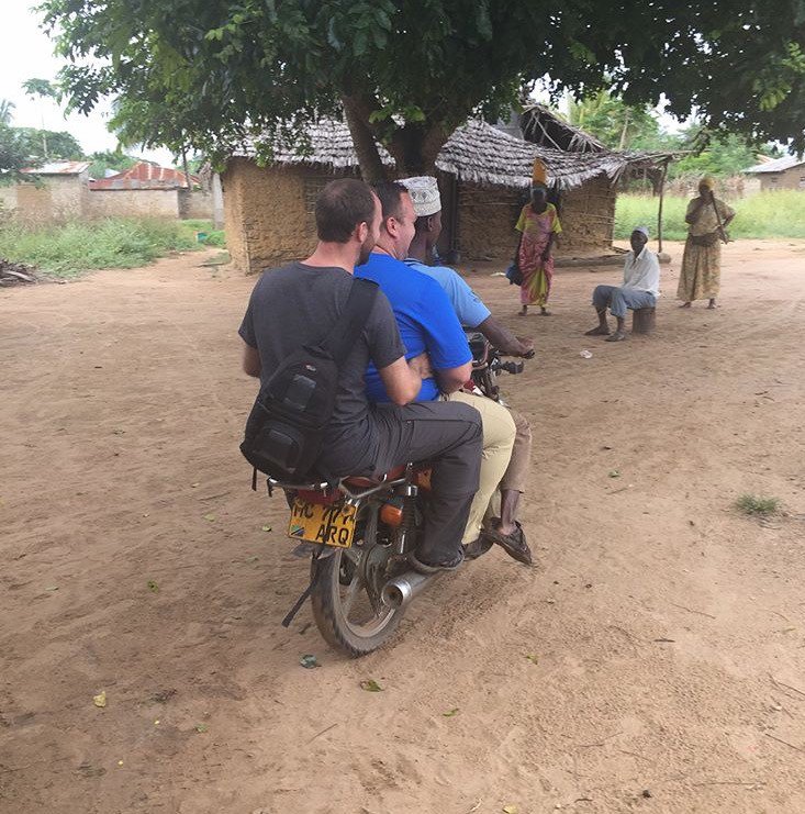 HopeStoryCA's tweet photo. Our fearless leader, Tim Brown, and supporter  @twarden14 trying out local transport in #Tanzania. #TwoTimsOnABoda #BodaBoda @timcogroup https://t.co/hoDYtOWkk2
