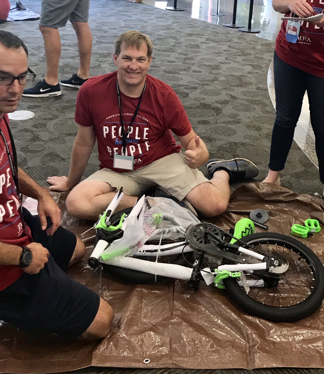CUNA's tweet photo. #CUNACMS students celebrate the credit union difference by building bikes for kids #peoplehelpingpeople #cudifference @NCUFoundation https://t.co/0eWzaB9c2F