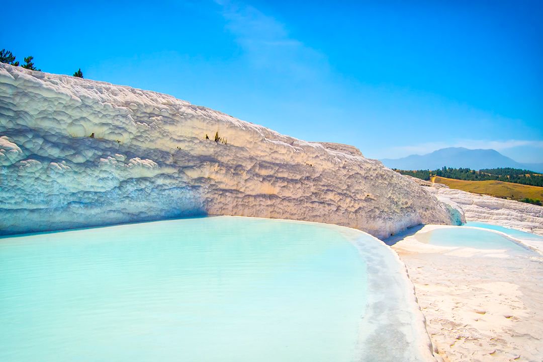 atlasandboots's tweet photo. A2: Keeping with the theme of alien landscapes, the travertine terraces of Turkey's Pamukkale were surreal #LPchat https://t.co/Tm0o1VYJGJ