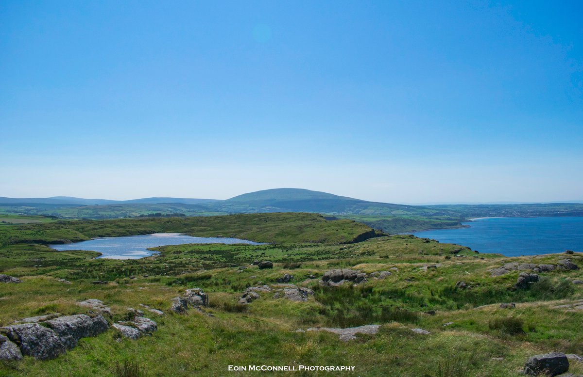 Lough Dhu at the top of Fair Head with Ballycastle to the right and Knocklayde Mountain behind @ILoveNorthCoast @BallycastleVIC <a href="/DiscoverNI/">Northern Ireland</a>