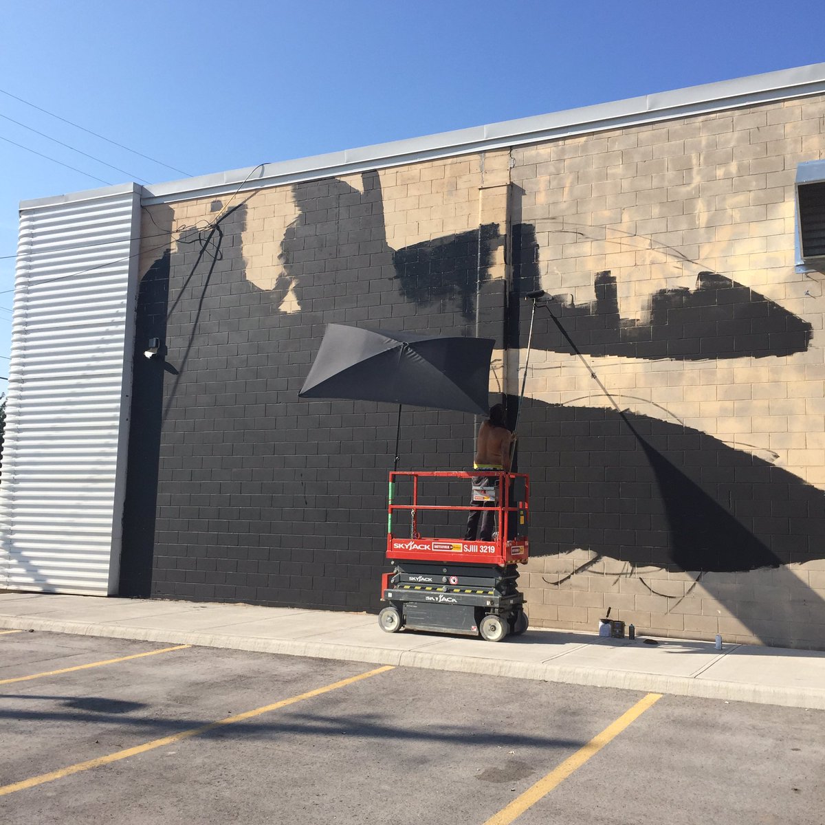 HOPAports's tweet photo. Priming is underway for the new mural with @shalakattack @bruno_smoky @CollectiveHam #thewallproject #HamOnt https://t.co/KKGu1fz3zf