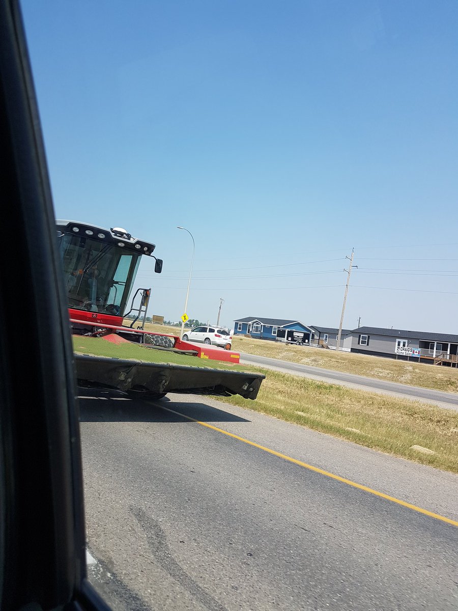 twistedmindfarm's tweet photo. This dam hutterite is driving a swather with an air conditioned cab. I bet it's payed for too. I'm so freaking jealous. #hutteritelife https://t.co/4Dn6xsbNke